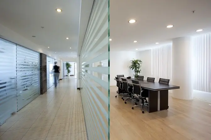 Office conference room with decorative striped window film.