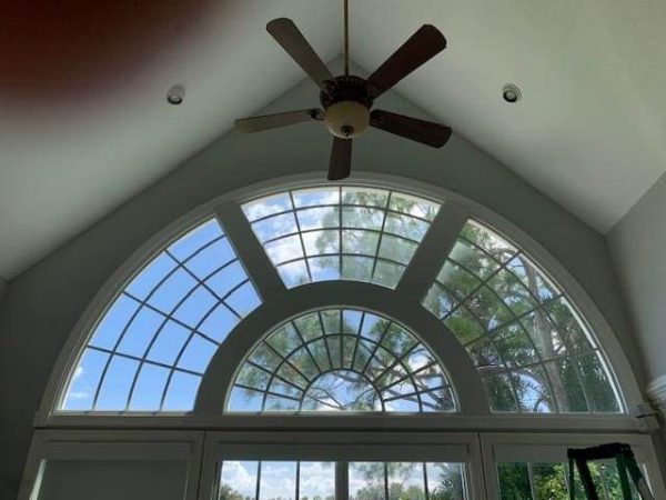 3M™ Scotchshield™ Safety & Security Window Ultra Prestige Safety & Heat Rejection Totally Clear Half-circle window above doorway.