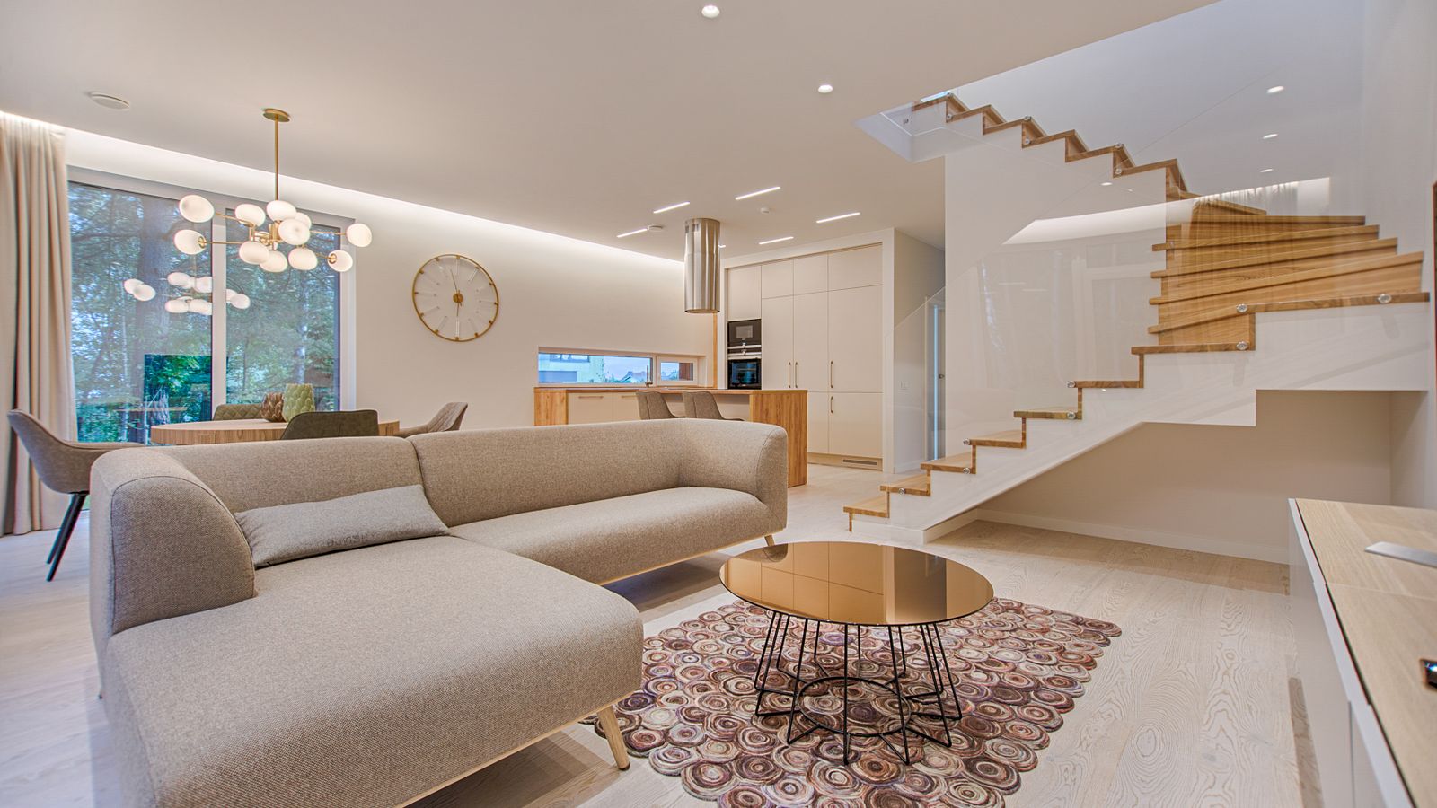 Bright living room with sun pouring through large windows, showing where does window film reduce heat inside a Sarasota home