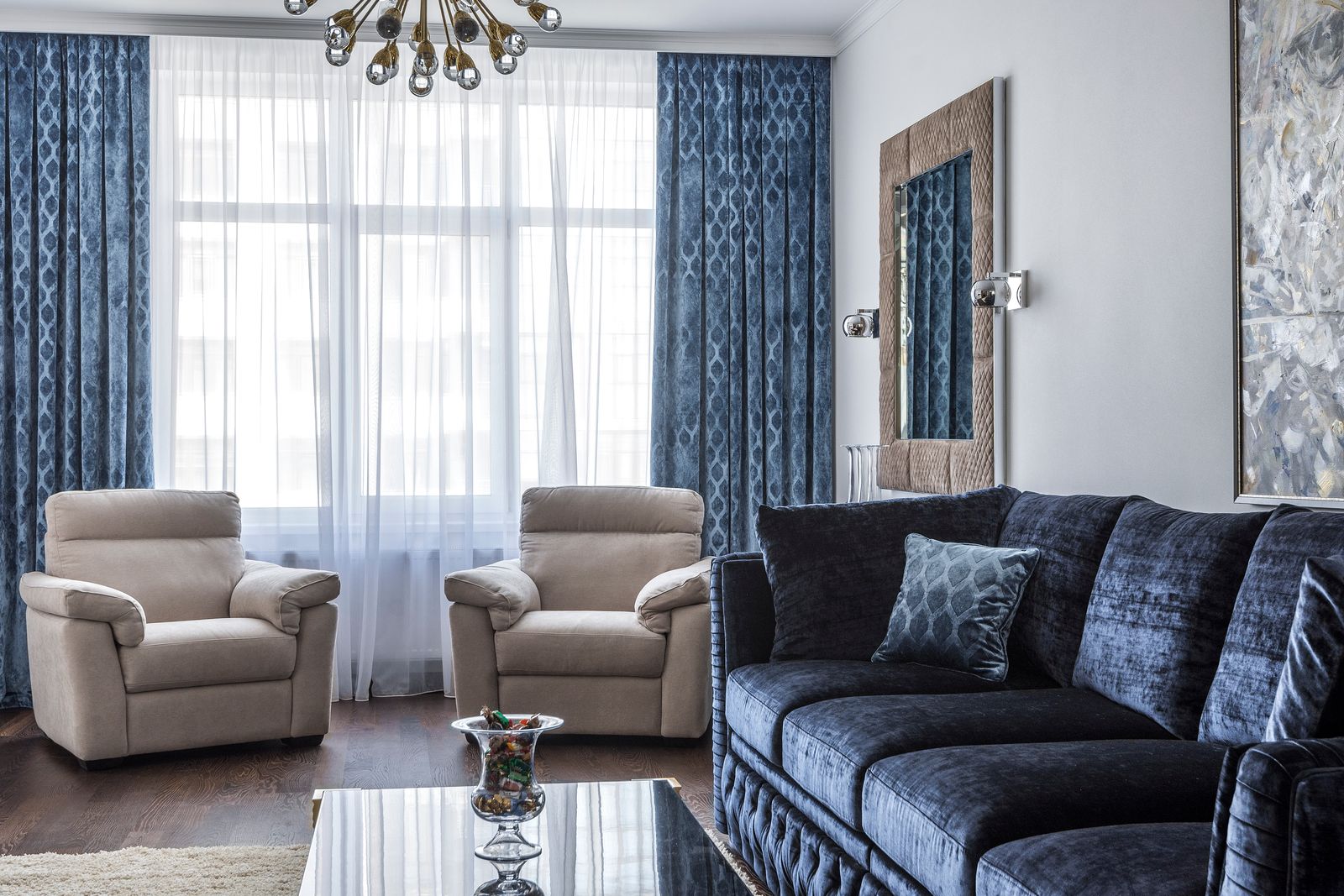 Comfortable cool living room with a large daylit window after solar window film
