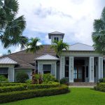 Florida home with palm trees and large windows, a candidate for long-lasting 3M window film