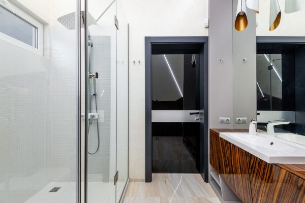 Frosted window film on a bright bathroom glass door for daytime privacy