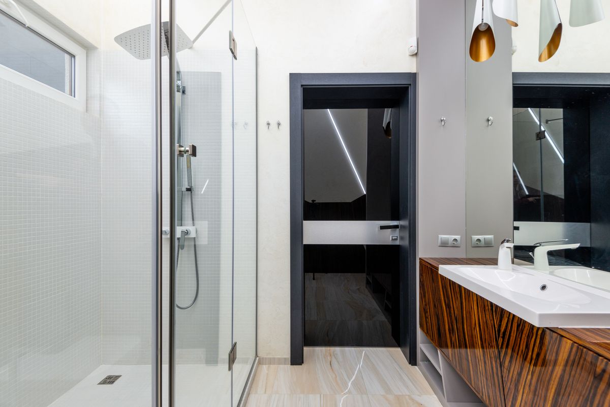 Frosted window film on a bright bathroom glass door for daytime privacy