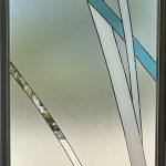 Frosted glass door with decorative abstract lines in clear and blue glass, intersecting vertically and diagonally, enhanced by a stylish 3M decorative film for added elegance.