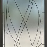 A decorative frosted glass door panel featuring an abstract design with intersecting curved lines, enhanced by elegant 3M decorative film.