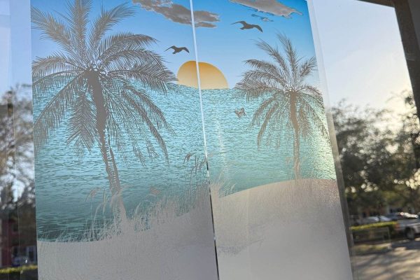 img_9686 Storefront window with beach sunset palm tree decorative film panels being installed