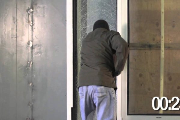 Video Thumbnail: Nbisuncontrol Safety and Security Film for Schools Intruder pushing through a cracked glass door reinforced with safety film, timer reading 00:23