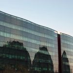 One way window film creating a reflective mirror look on a glass building exterior
