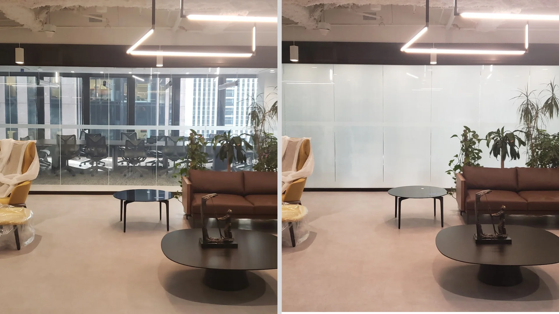 Large glass wall with two sections labeled "ON" and "OFF"; the "ON" section is transparent, showing a meeting room, while the "OFF" section is opaque.