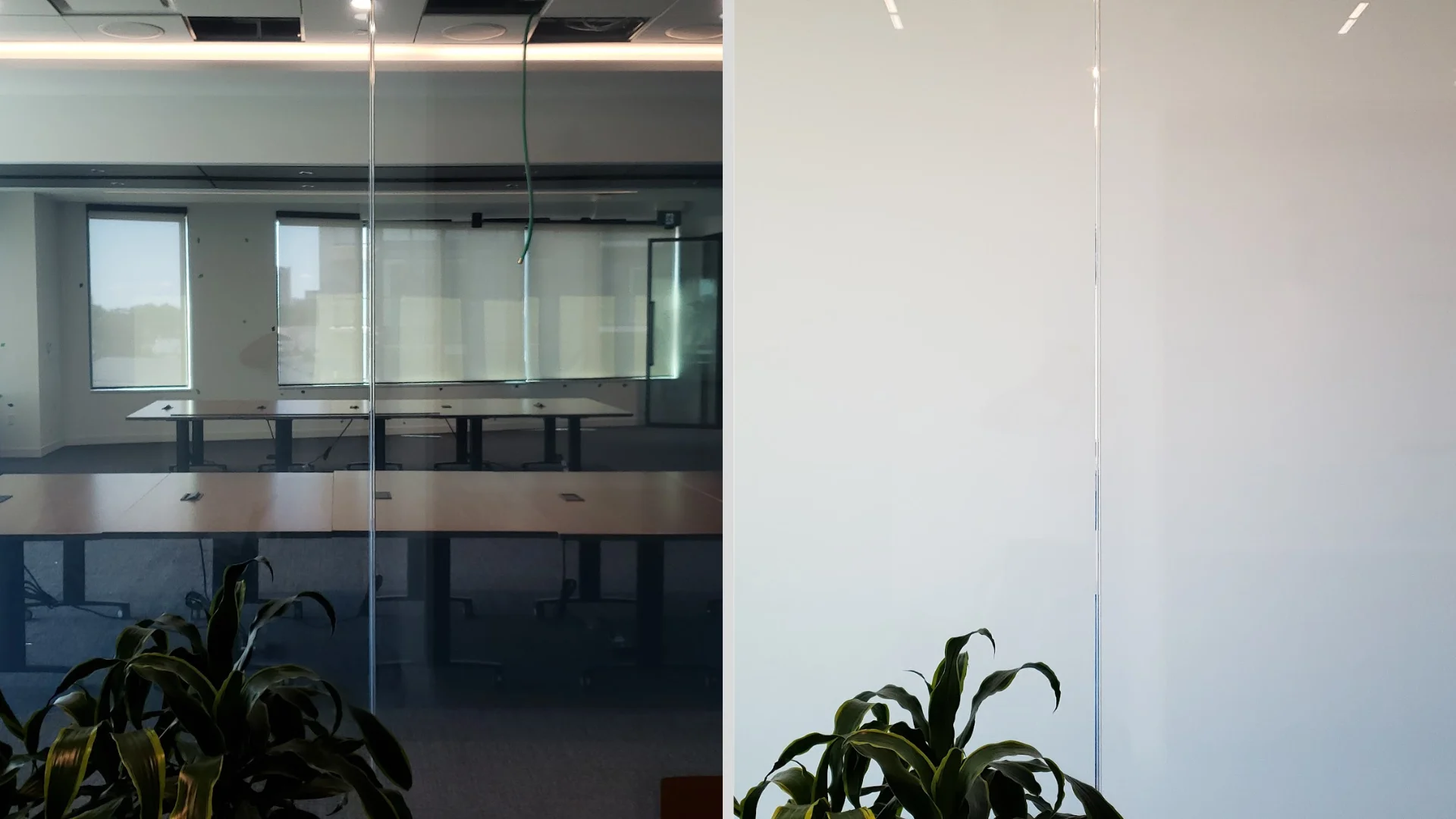 Large glass wall with two sections labeled "ON" and "OFF"; the "ON" section is transparent, showing a meeting room, while the "OFF" section is opaque.