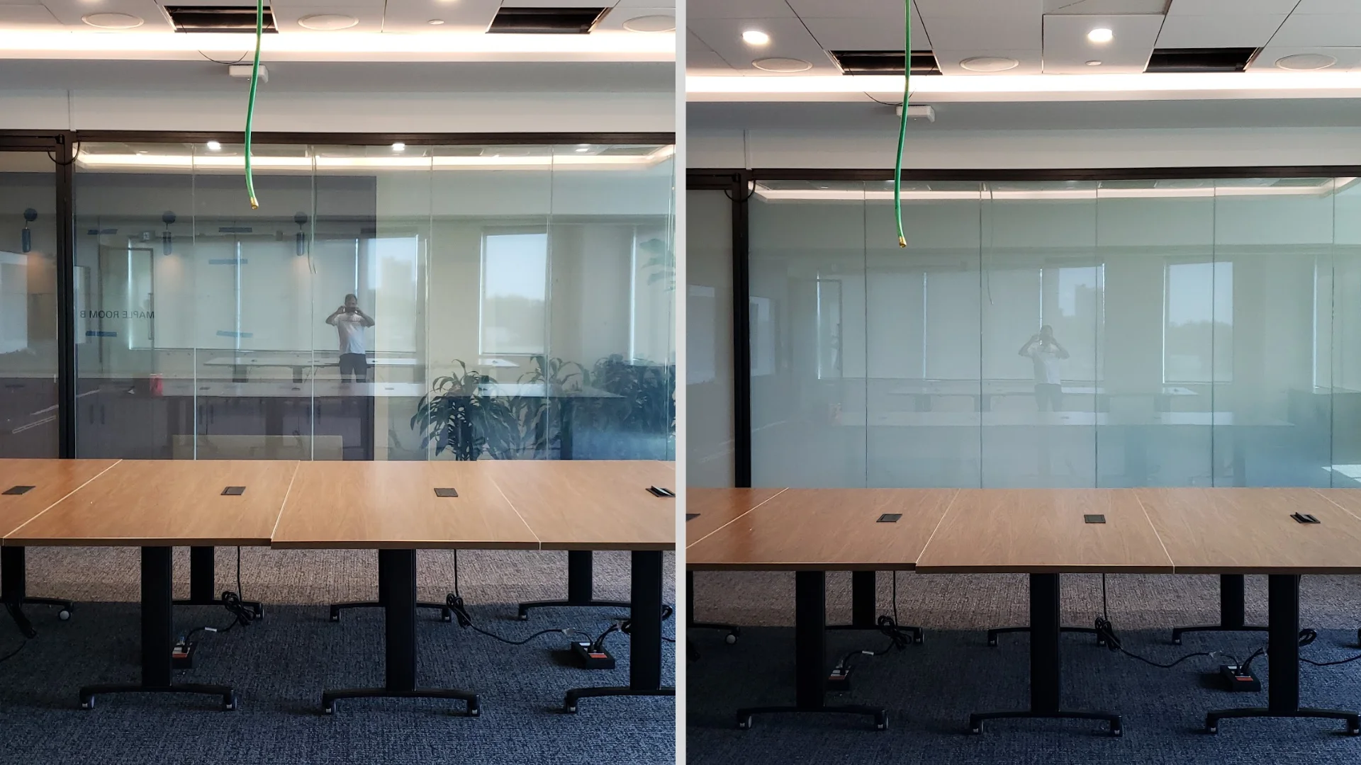 Large glass wall with two sections labeled "ON" and "OFF"; the "ON" section is transparent, showing a meeting room, while the "OFF" section is opaque.