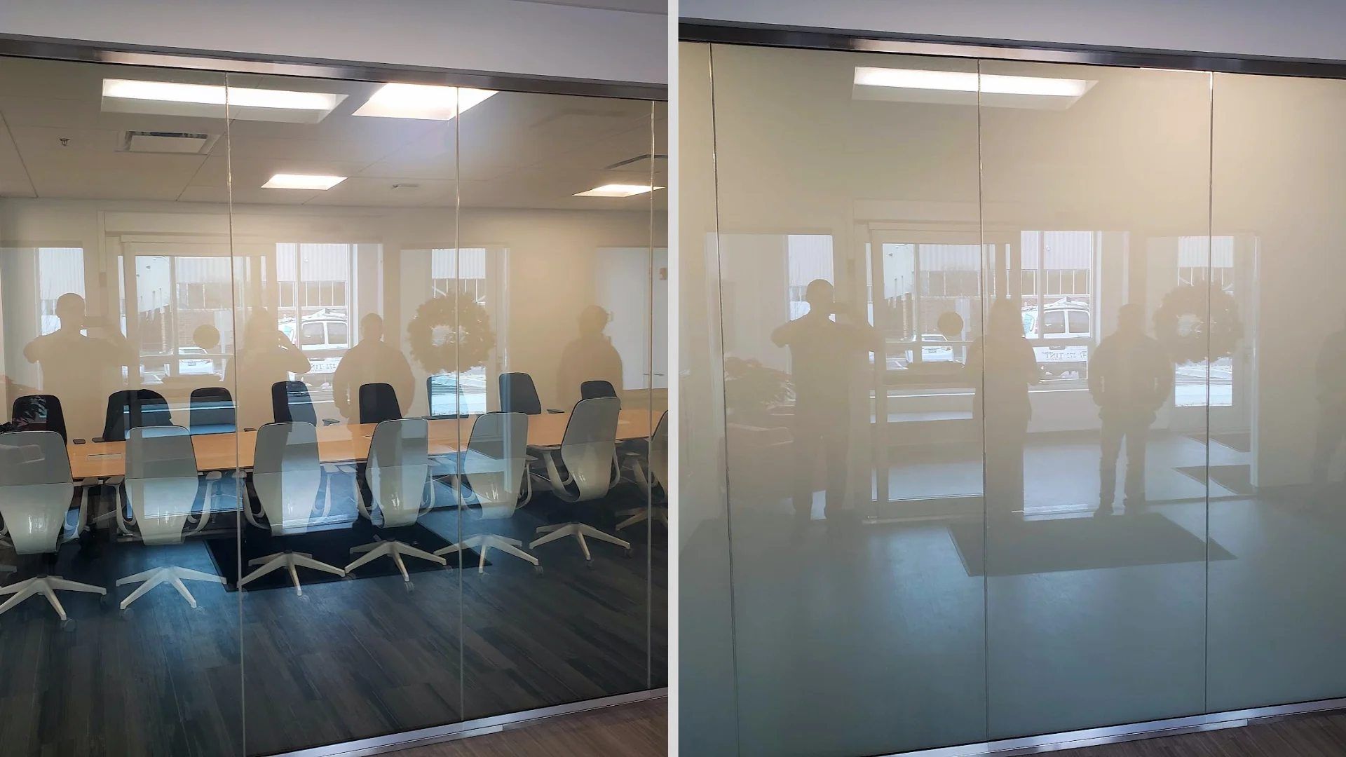 Large glass wall with two sections labeled "ON" and "OFF"; the "ON" section is transparent, showing a meeting room, while the "OFF" section is opaque.