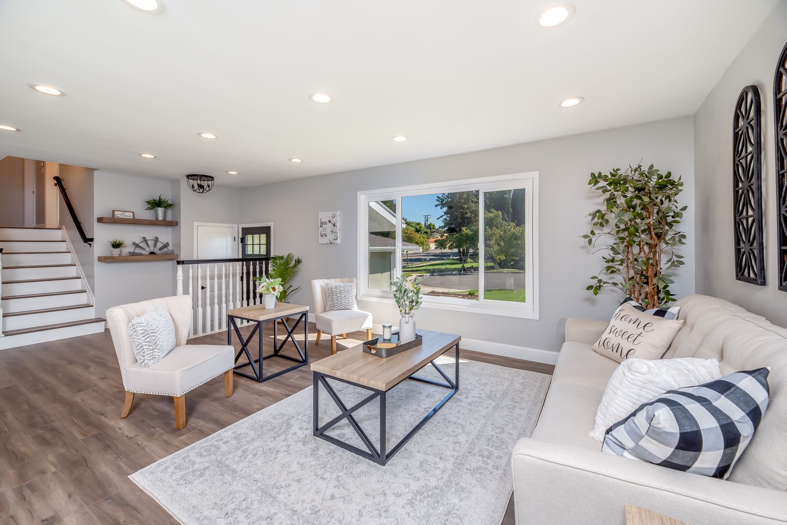Bright living room with a large window letting in strong Florida sun