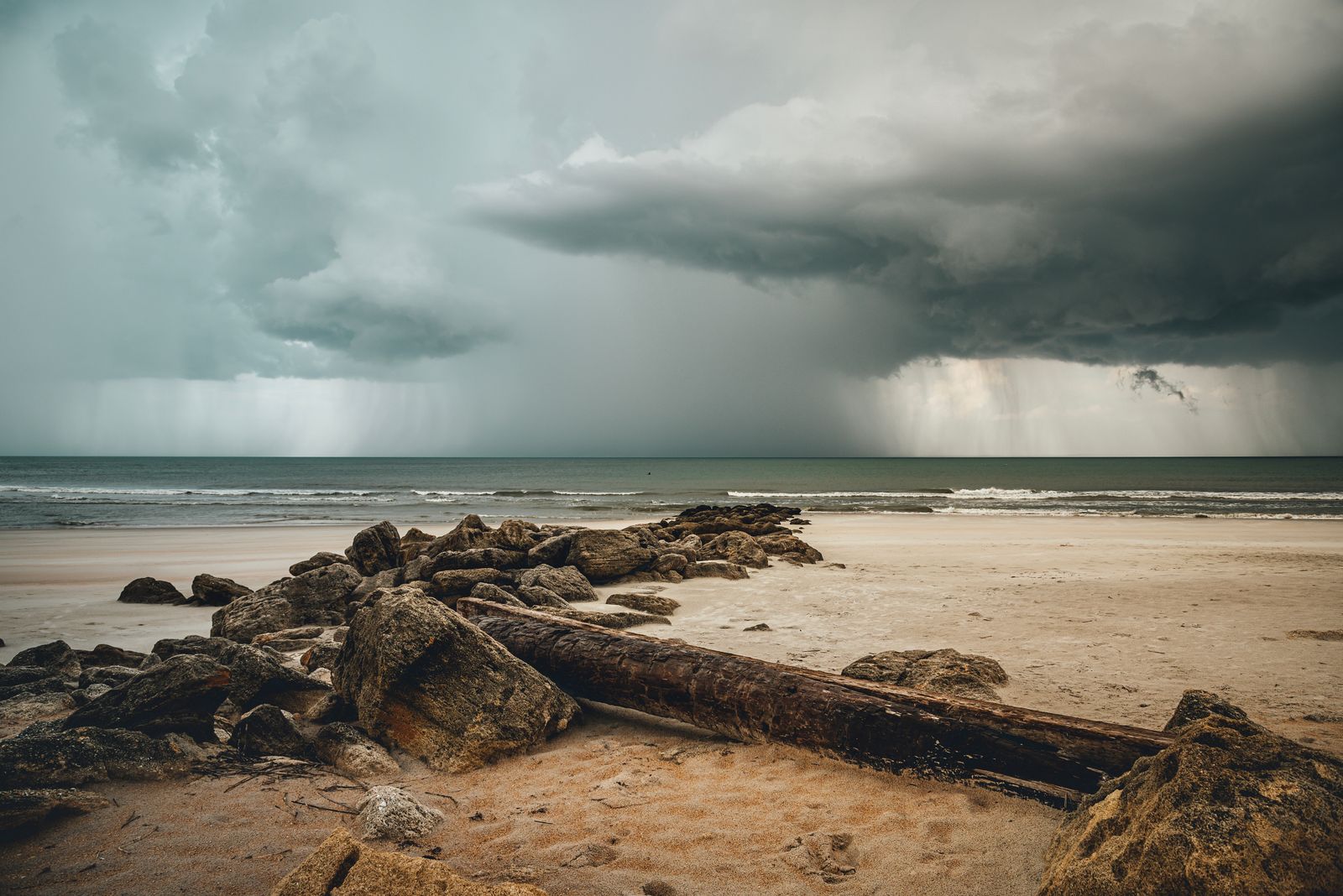 Storm rolling in over the Gulf coast, the time of year homeowners ask does window film protect against hurricanes