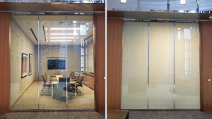 Glass conference room wall shown clear then with frosted privacy film for meeting privacy