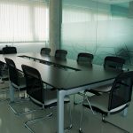 Glass walled conference room that can be switched from clear to private